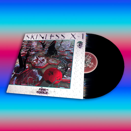 A vinyl LP of 'Skinless X-1' by Fire-Toolz with a colorful abstract design on the cover.