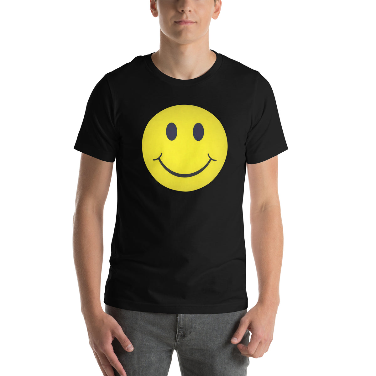 Person wearing a black t-shirt with a yellow smiley face design on a white background