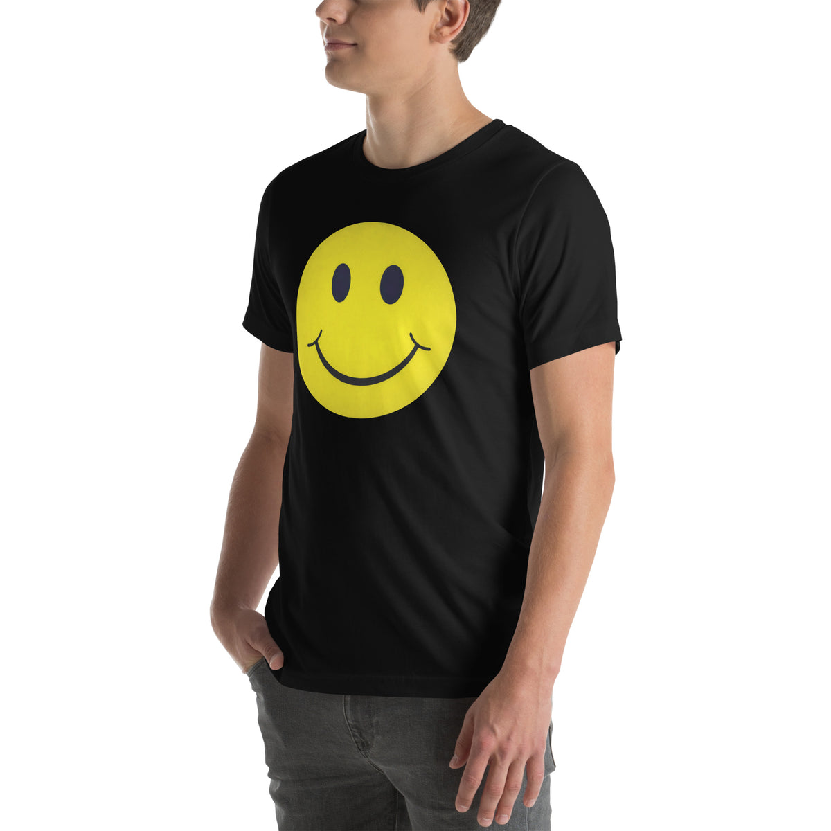 Person wearing a black t-shirt with a yellow smiley face design on a white background