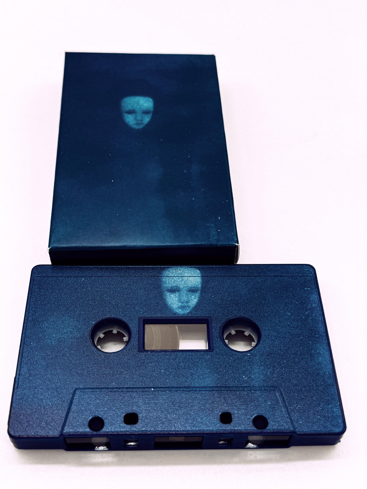 Blue Yapping Portal cassette tape and cover on a white background.