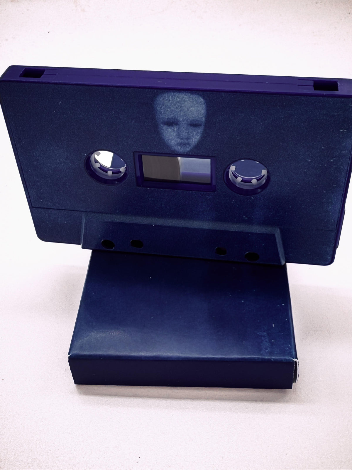Blue Yapping Portal cassette & cassette box on a white background.